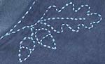 acorns embroidery design, pale blue on denim